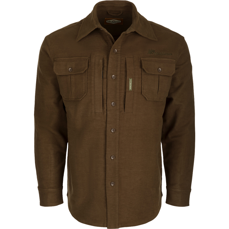 A brown jac-shirt with pockets, crafted with cotton/spandex blend and dry waxed canvas elbow patches. Windproof and stretchy for unrestricted movement.