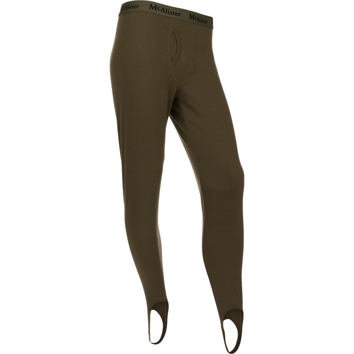 McAlister Merino Base Layer Pant: A pair of holey trousers with elastic waistband and foot stirrups for comfort and secure fit.