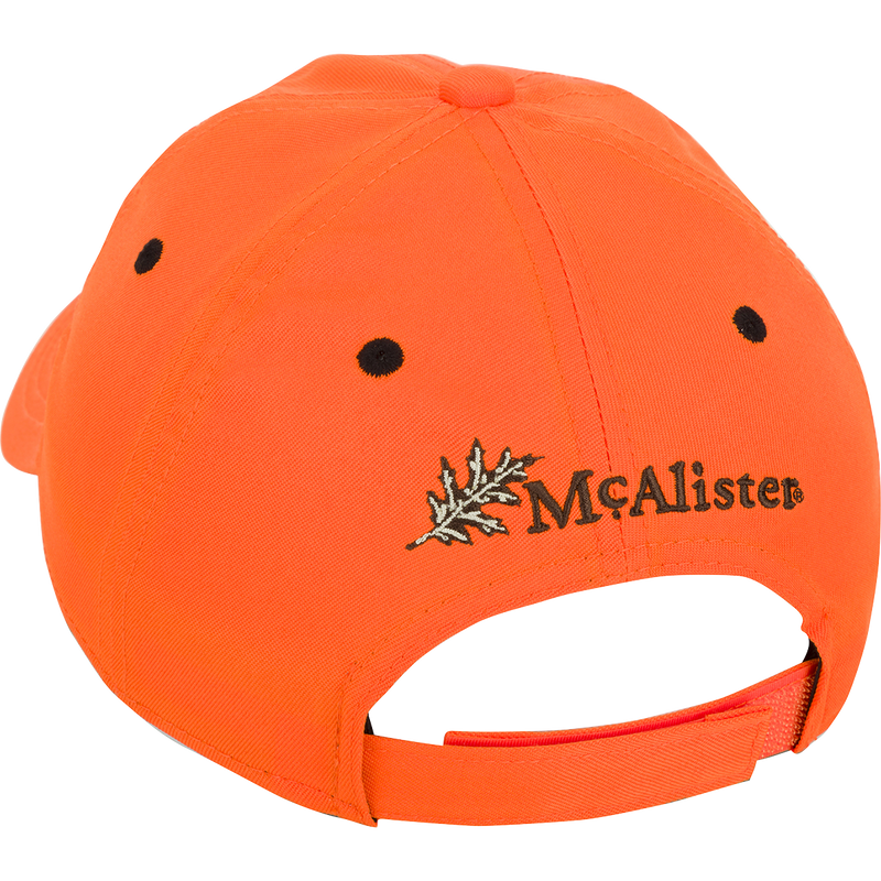 McAlister Upland Embroidered Twill Cap: A low-profile ball cap with an orange fabric featuring a black dotted pattern and a leaf. Adjustable Velcro closure for a perfect fit.