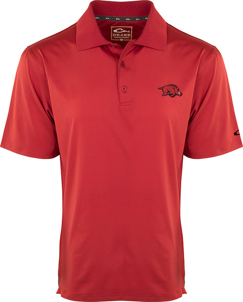 A red Arkansas Performance Stretch Polo with a pig logo on the left chest. Moisture-wicking, breathable, and comfortable for game day or outdoor activities.