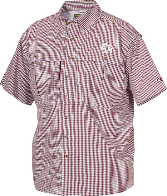 A breathable and quick-drying Texas A&M Plaid Wingshooter's Shirt with front and back ventilation. Features University of Texas A&M logo embroidered on left chest. Perfect for outdoor activities or casual office days.