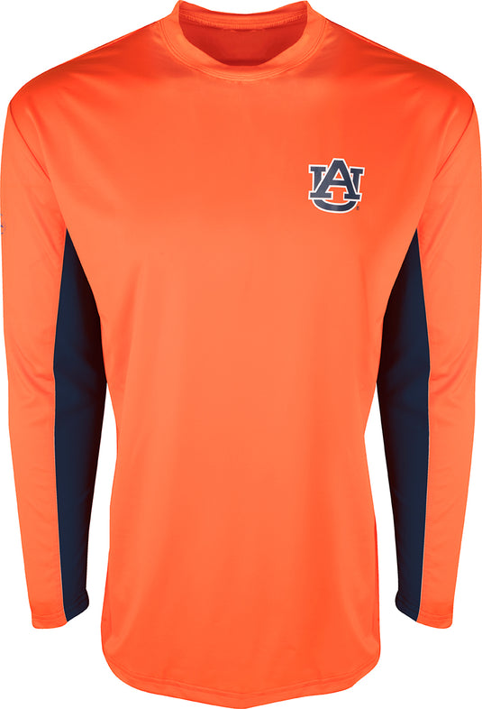 Auburn L/S Performance Crew: A long-sleeved orange shirt with a logo on it. Built for all-day sun protection and comfort. Breathable mesh on the back and underarms keeps you cool. Shield 4™ technology guarantees all-around protection.