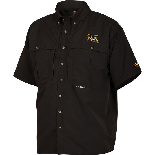 Missouri Wingshooter's Shirt S/S: Breathable, quick-drying black shirt with University of Missouri logo. Features front and back ventilation, stand-up collar for sun protection, and multiple chest pockets. Ideal for outdoor activities or casual office wear.