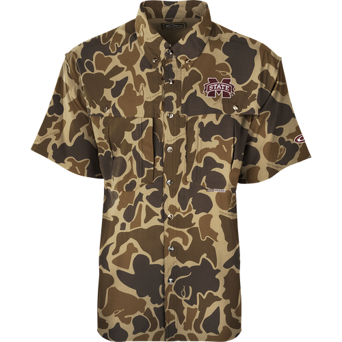 Mississippi State S/S Flyweight Wingshooter: A camouflage shirt with a logo, made of ultra-lightweight polyester. Quick-drying, moisture-wicking, and breathable. Features include vented back, UPF 50+ sun protection, Magnattach™ chest pocket, and a vertical zipper pocket. Ideal for warm-weather outdoor activities.