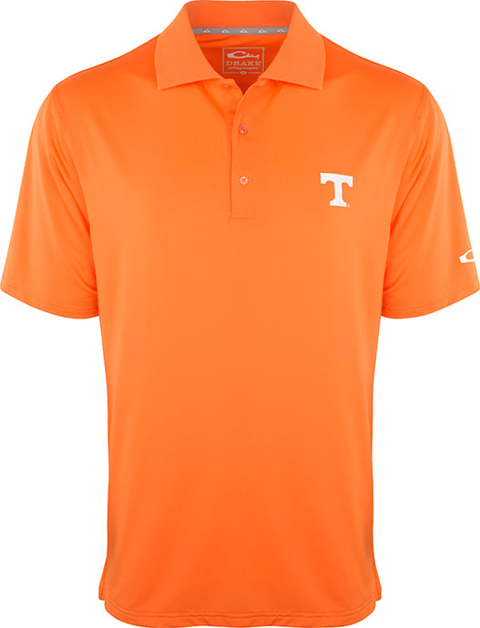 Tennessee Performance Stretch Polo - An orange polo shirt with a white T logo, perfect for the big game or a round of golf. Made of 92% polyester and 8% spandex, it offers four-way stretch, quick-drying, moisture-wicking, and breathability. Official Alabama logo on the left chest.
