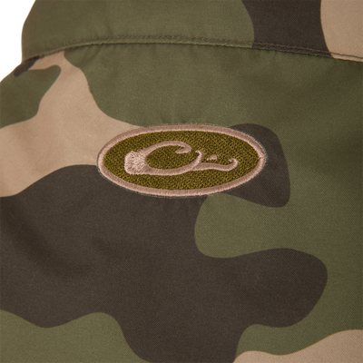 MST Eqwader Vest featuring a close-up of its waterproof shoulder fabric, logo, and functional pockets, ideal for hunting with breathable fleece lower torso.