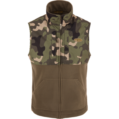 MST Eqwader Vest featuring camouflage design, mid-layer insulation, waterproof shoulders, and breathable fleece lower body, with secure chest pockets for hunting essentials.