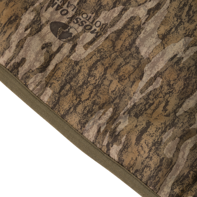 MST Endurance Quarter Zip Jacket with Hood, featuring a camouflage-patterned fabric, adjustable fleece-lined hood, and practical pockets for outdoor activities.