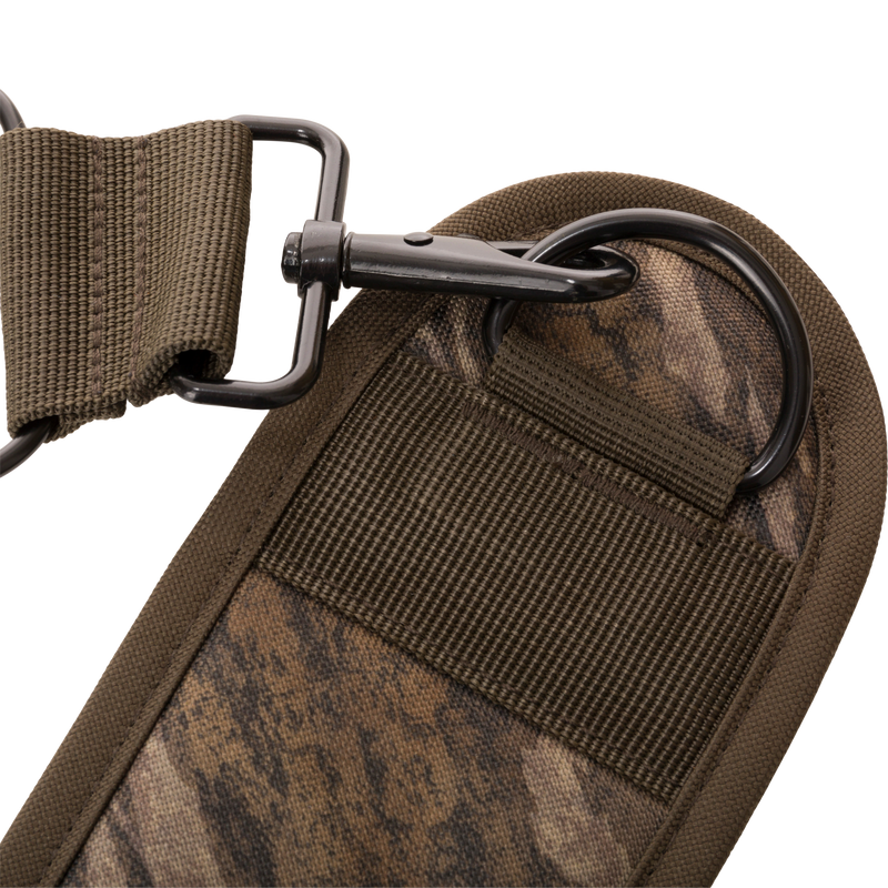 Close-up of the 3-Way Duck Tote's padded fabric strap with camo print, featuring a black metal hook and D-ring for versatile, comfortable carrying.
