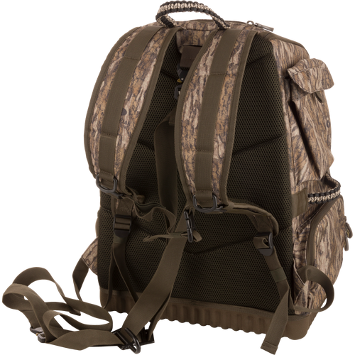 Tree Hugger Timber Pack, featuring a camo design, padded mesh back, adjustable straps, side pockets, ideal for rugged outdoor activities like hunting and hiking.