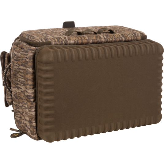 Tree Hugger Timber Pack, a camo-patterned, padded carry bag with molded-foam front, top grab handle, waterproof bottom, and multiple organizational pockets for hunting gear.