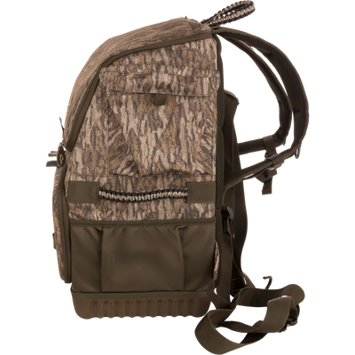 Tree Hugger Timber Pack, camouflage backpack with padded straps, multiple pockets, molded base, webbing loops, and carry handle, designed for co-hunting storage and gear organization.