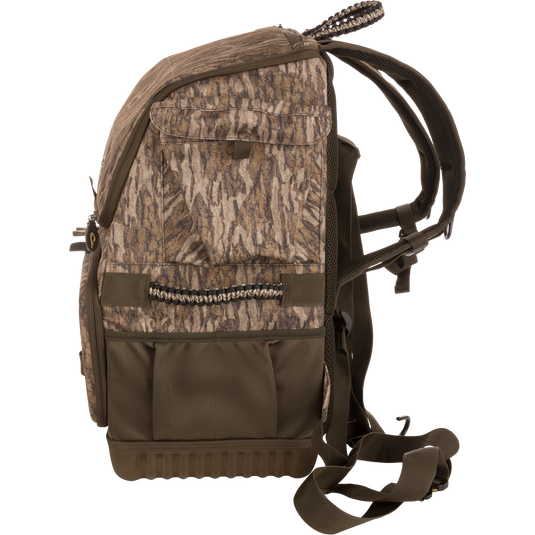 Tree Hugger Timber Pack, camouflage backpack with padded straps, multiple pockets, molded base, webbing loops, and carry handle, designed for co-hunting storage and gear organization.