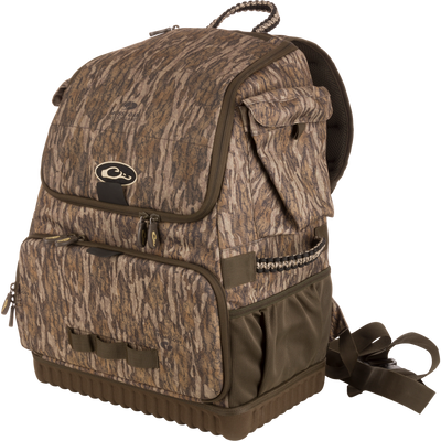 Tree Hugger Timber Pack with camo pattern, multiple zippered compartments, padded straps, molded hard bottom, paracord detailing; ideal for outdoor activities like hunting or fishing.