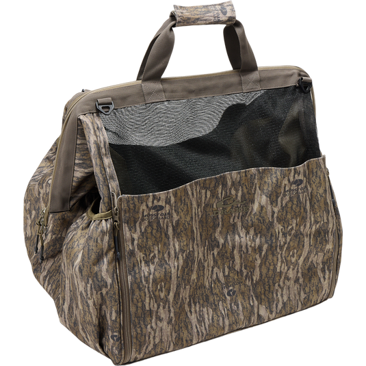 Guardian Elite Wader Bag with camo pattern, mesh panel, padded handles, zippered side pockets, and Mossy Oak/Drake branding, ideal for hunting gear transport.