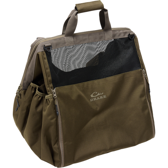 Guardian Elite Wader Bag with Drake logo, featuring a trapezoidal, ventilated design, hand and backpack straps, zippered floor mat, and side boot pockets for waterfowl gear.