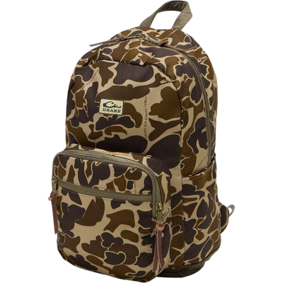 Limited Edition Throwback 80 Backpack, featuring rugged canvas, suede bottom, sturdy cotton webbing, antique bronze buckles, and large zippers, perfect for durable hauling.