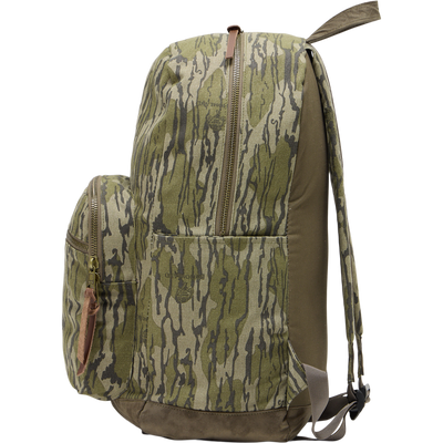 Close-up of the Limited Edition Throwback 80 Backpack featuring rugged cotton canvas, suede reinforcement, durable webbing, and antique bronze hardware, ideal for outdoor adventures.