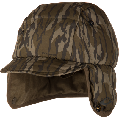 Camouflage bucket hat with quilted design, featuring fold-down ear flaps and adjustable toggle, offering warmth and durability for outdoor hunting in variable conditions.