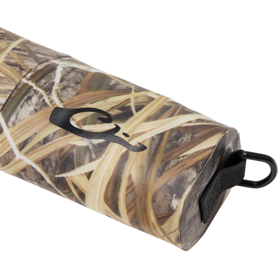 Hardline Waterproof Gun Case with marsh-grass camouflage, features a D-ring clip and neoprene sleeve, designed to keep shotguns dry and floatable.