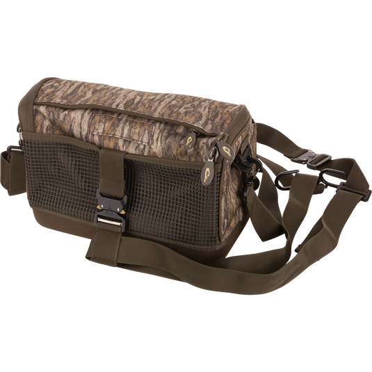 Tree Hugger Shoulder Bag with camo-style fabric, grid-mesh pocket, waterproof bottom, dual zippers, and adjustable strap, ideal for hunting or fishing gear.