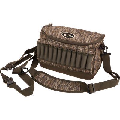 Tree Hugger Shoulder Bag with camo pattern, adjustable strap, and external elastic loops, ideal for carrying hunting gear and shotgun shells.