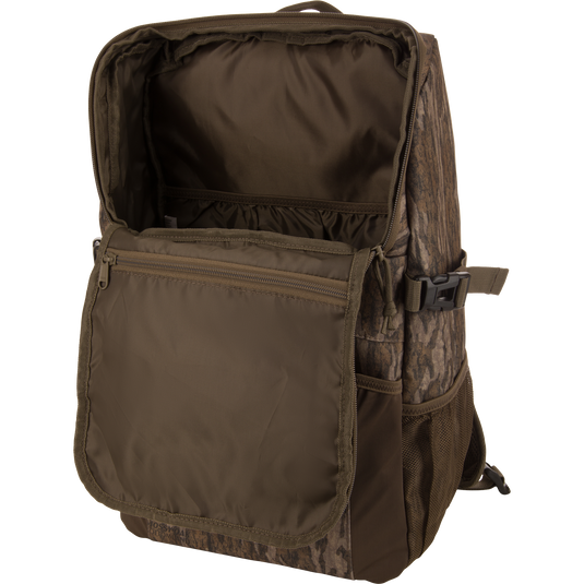 Drake Day Pack with unzipped main compartment, inner pockets visible. Features rugged, water-resistant material, ideal for hunting adventures and outdoor use.
