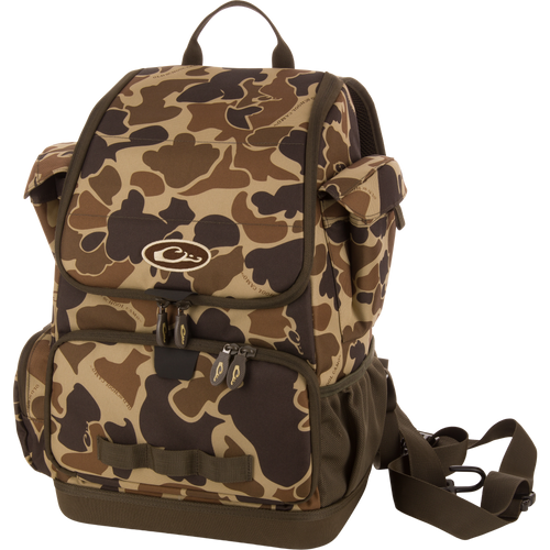 Tree Hugger Timber Day Pack with camo pattern, multiple compartments, padded straps, and included adjustable strap, ideal for outdoor excursions and rugged weather conditions.