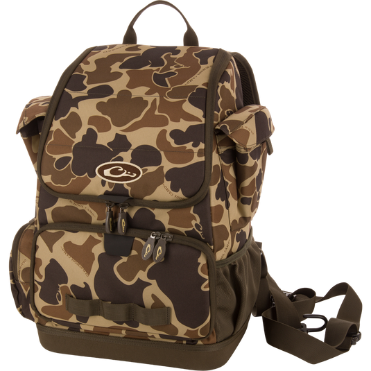 Tree Hugger Timber Day Pack with camo pattern, multiple compartments, padded straps, and included adjustable strap, ideal for outdoor excursions and rugged weather conditions.