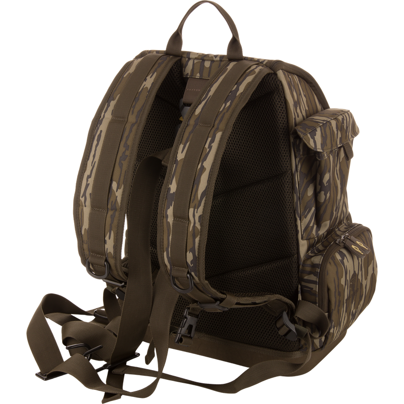 Back view of the Tree Hugger Timber Day Pack with padded straps, mesh panel, waist belt, side zippered pockets, and top handle, ideal for rugged outdoor excursions.
