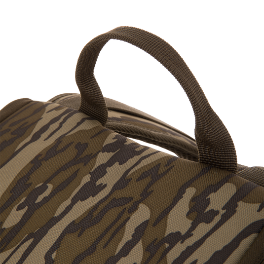 Camouflage-patterned Tree Hugger Timber Day Pack showcasing its woven carry handle on rugged HD2™ material, designed for outdoor excursions with water-resistant features.