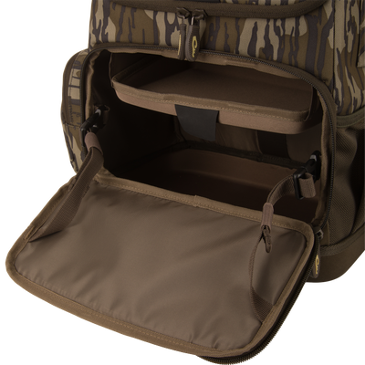 Tree Hugger Timber Day Pack with open front compartment, showing padded shelf and empty storage, designed for outdoor excursions with rugged, water-resistant features.