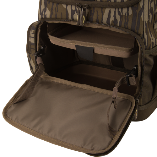Tree Hugger Timber Day Pack with open front compartment, showing padded shelf and empty storage, designed for outdoor excursions with rugged, water-resistant features.