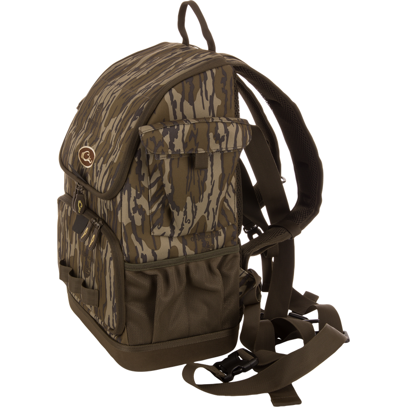 Camouflage-patterned Tree Hugger Timber Day Pack with multiple pockets, padded straps, and waterproof features, designed for outdoor excursions and hunting gear storage.