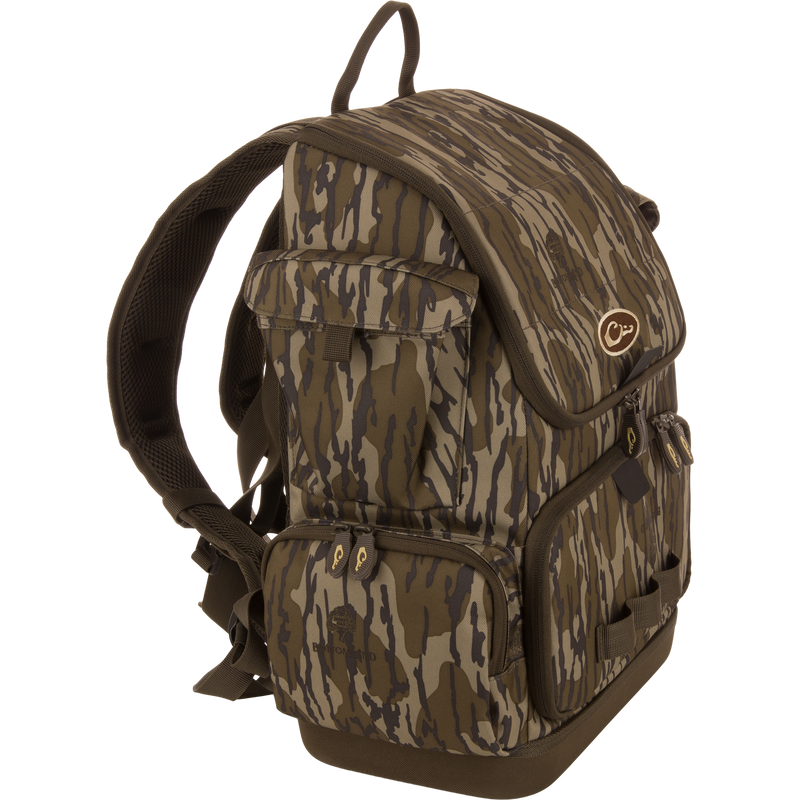 Tree Hugger Timber Day Pack with padded straps, multiple compartments, floatable hardshell, waterproof base, and quick-access pockets, ideal for outdoor excursions and hunting.
