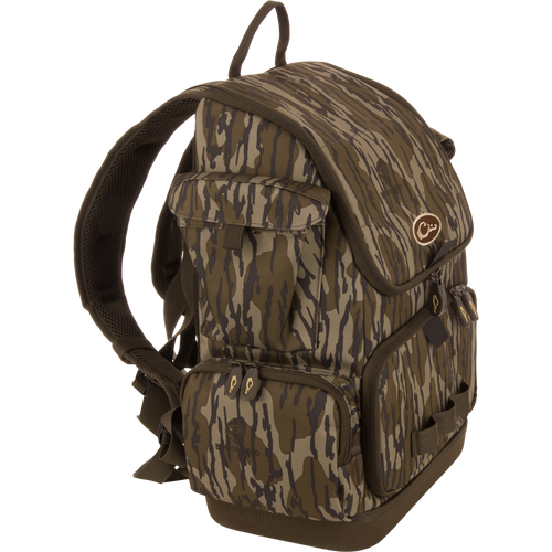 Tree Hugger Timber Day Pack with padded straps, multiple compartments, floatable hardshell, waterproof base, and quick-access pockets, ideal for outdoor excursions and hunting.