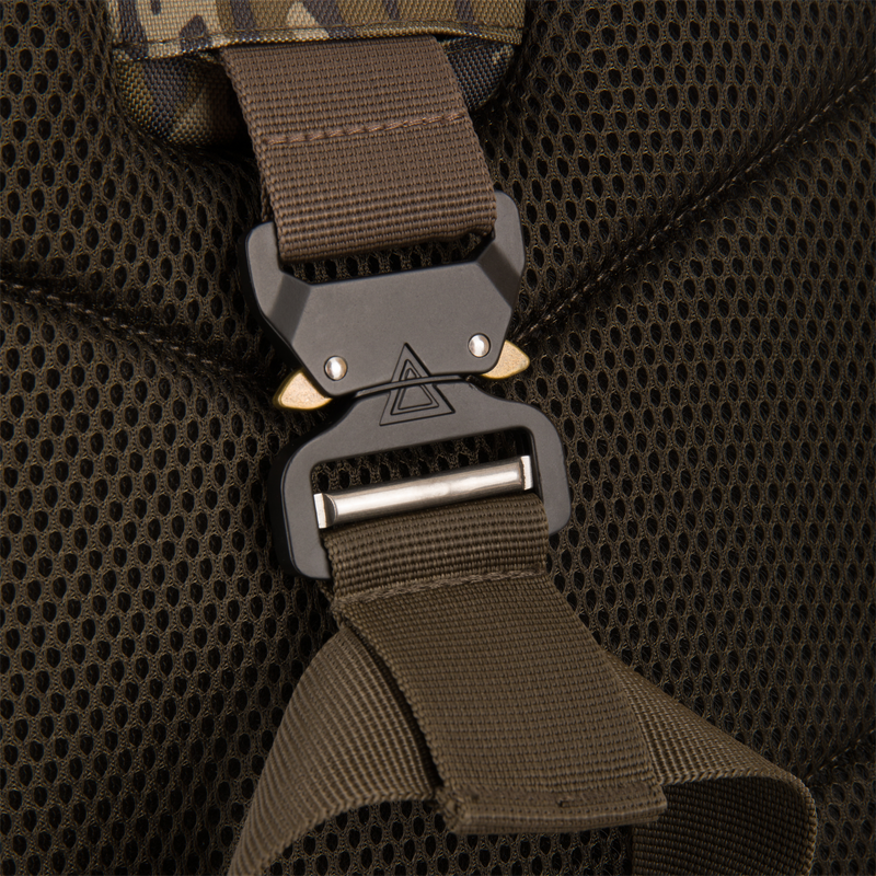 Close-up of the Tree Hugger Timber Day Pack's strap featuring a quick-release cobra-style buckle, highlighting the padded mesh back panel and durable construction.