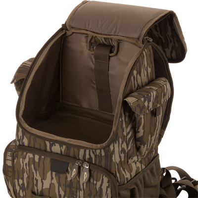 Tree Hugger Timber Day Pack with open main compartment, side pouches, front zip pocket, adjustable straps, showcasing its rugged, water-resistant design for outdoor adventures.
