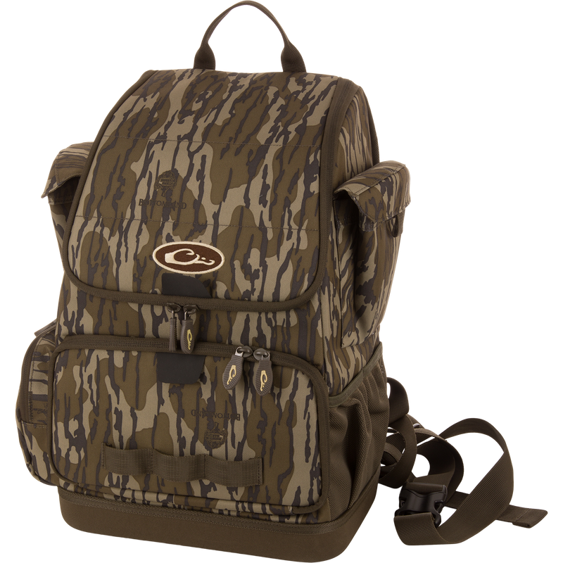 Tree Hugger Timber Day Pack with camo pattern, multiple compartments, and durable construction, designed for outdoor excursions with large storage and a waterproof bottom.