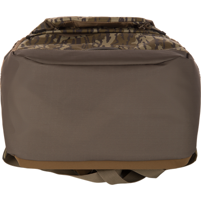 Back view of CommandXT Quick Load Pack, featuring a padded olive-brown back panel, camo-patterned zippered flap, and tucked carry straps, ideal for durable, organized carry.