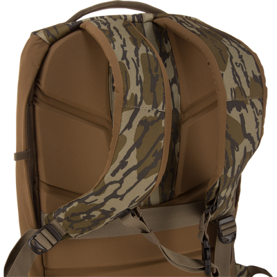 CommandXT Quick Load Pack with padded shoulder straps, camouflage webbing, and adjustable buckles, designed for durability, organization, and all-weather performance.