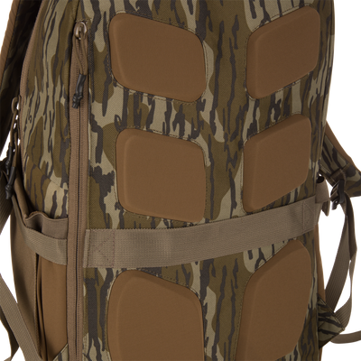 Close-up of the Campus Backpack's tiger-stripe camo panel, showing padded inserts, zipper pull, and adjustment straps, highlighting its tactical design and versatility.