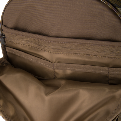 Inside view of the Campus Backpack's main compartment, showcasing brown, tightly woven fabric lining with stitched pockets, highlighting its organizational features and durability.