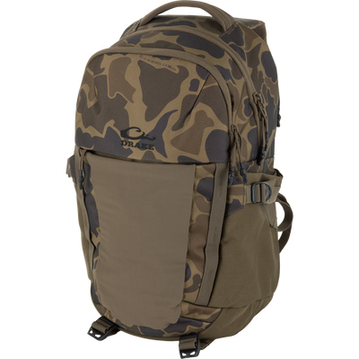 Drake's Campus Backpack with camo design, featuring multiple compartments, webbing straps, and logo, ideal for versatile use and organized gear storage.