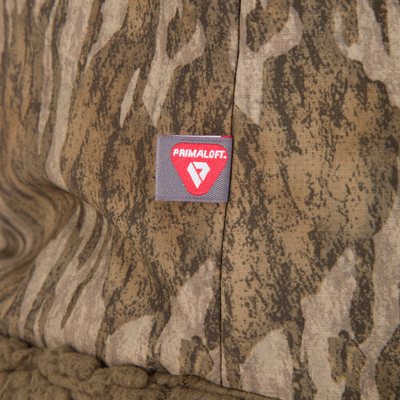 Close-up of LST BMF Gaiter with Primaloft, showcasing stitched seam, woven label, and sherpa fleece lining for warmth and mobility in cold, active conditions.