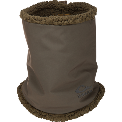 Olive neck gaiter by Drake, featuring a smooth outer shell, plush fleece lining, adjustable toggle, and Primaloft insulation for cold-weather protection and mobility.