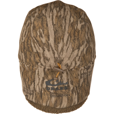 LST BMF Bomber Hat with Primaloft features a Mossy Oak pattern, fleece-lined brim, and adjustable toggle, ideal for cold-weather hunting.