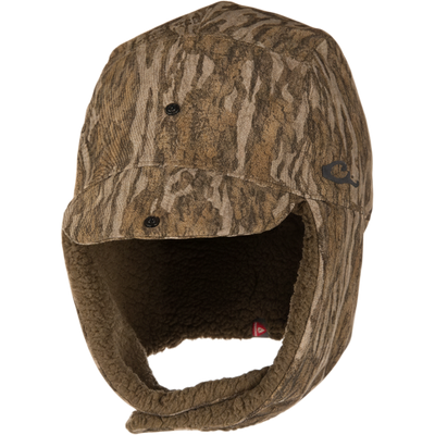 Camouflage-patterned LST BMF Bomber Hat with Primaloft, featuring fold-down ear flaps, Sherpa fleece lining, and adjustable toggle for warmth and protection in cold weather.