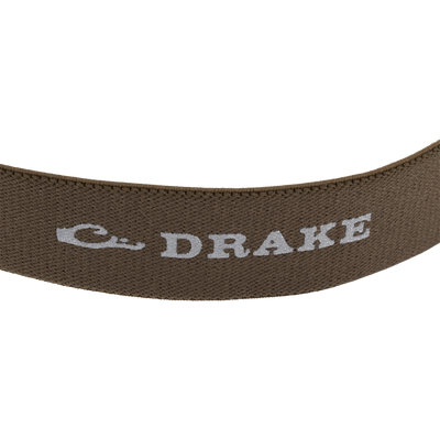 Close-up of brown woven strap with BRAKE embossed, part of the Lumen Headlamp EVO250, featuring a versatile, adjustable headband for outdoor use.