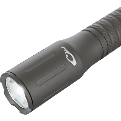 Lumen Flashlight EVO500 close-up, showing its knurled metal body and lens. Compact design with 500 lumens, AA battery-powered, ideal for hunting gear.